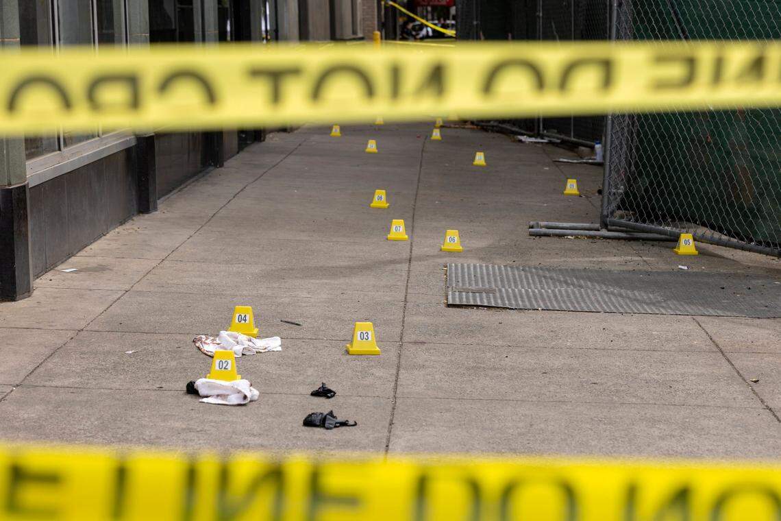 Evidence markers at the corner of 10th and J Street after the mass shooting on Sunday, April 3, 2022, in downtown Sacramento.