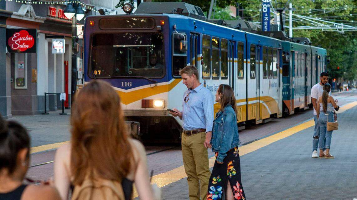 People walk near the 8th and K Street light rail station in downtown Sacramento in 2021. Ridership on Sacramento Regional Transit is about 70% of pre-pandemic levels, but fares are only a small portion of its revenue.