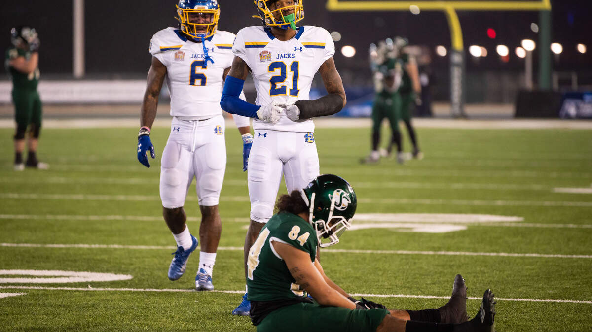 South Dakota State Jackrabbits cornerback Don Gardner (21), top, is called for pass interference on a ball intended for Sacramento State Hornets wide receiver Pierre Williams (84) during the third quarter of their second-round NCAA FSC college football playoff game Saturday, Dec. 4, 2021, at Hornet Stadium in Sacramento.