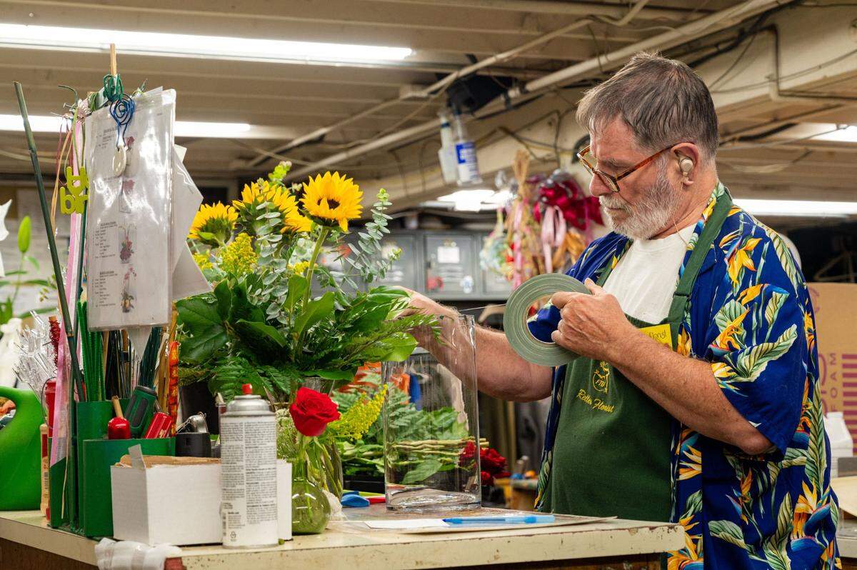 Designer John Relles arranges bouquets at Relles Florist in Sacramento on Tuesday.