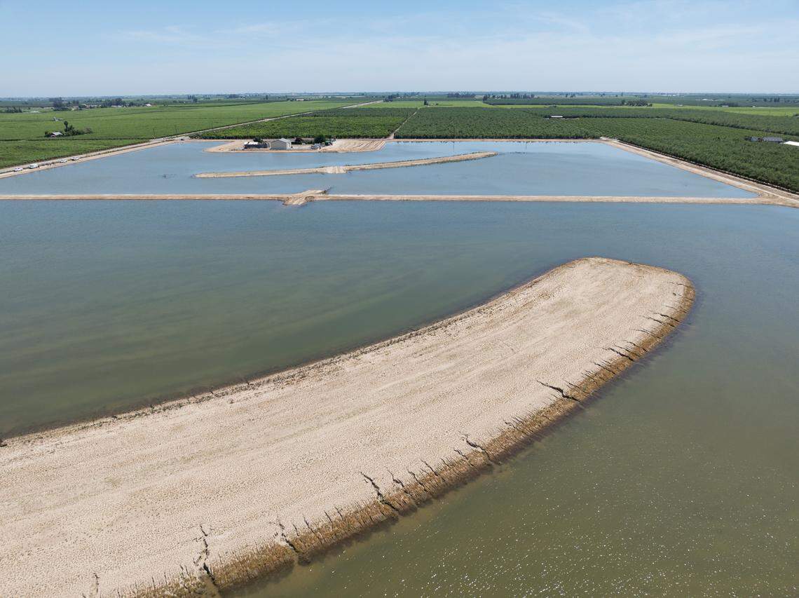 A drone photo of water diverted onto a newly constructed groundwater recharge basin at Mountain View and Temperance near Selma in Fresno County, California. Photo taken May 13, 2024. The California Department of Water Resources provided funding to Consolidated Irrigation District to support their efforts to expand groundwater recharge basins within the District.