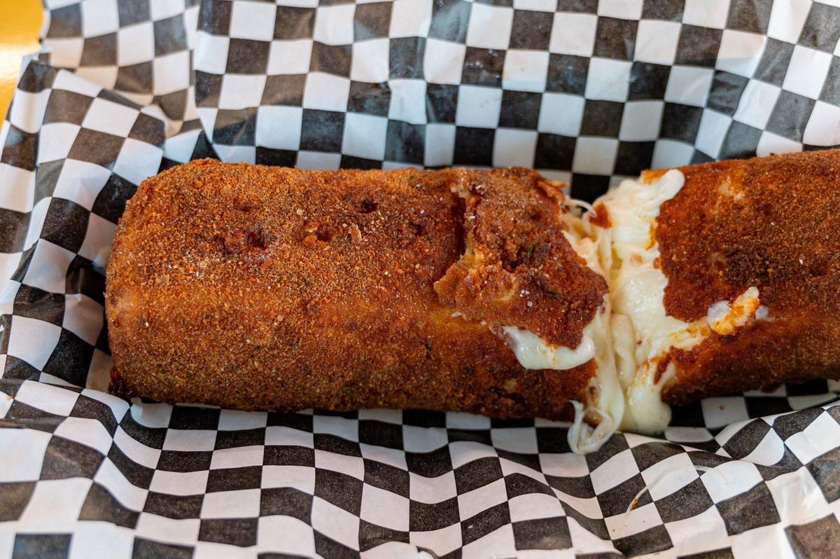 A one-pound, deep-fried mozzarella log is available at the Cheesy Chef in the California State Fair.