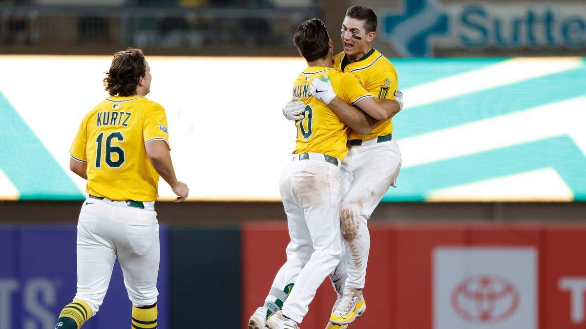 Jul 10, 2025; West Sacramento, California, USA; Athletics left fielder Tyler Soderstrom (21) celebrates with short stop Max Muncy (10) after the game against the Atlanta Braves at Sutter Health Park. Mandatory Credit: Sergio Estrada-Imagn Images