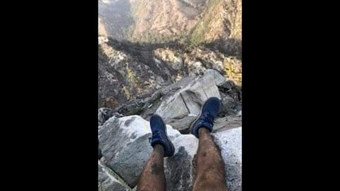 A hiker rescued from the Angeles National Forest with the help of a photo he sent a friend was found in a restricted burn area, California officials say.