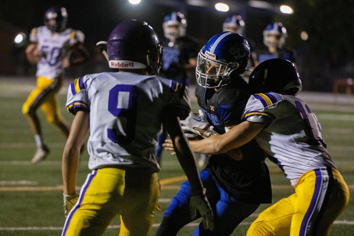 El Dorado’s Ryan Wilson scores a touchdown in the first quarter as Bret Harte’s Troy Dragomanovich (13) attempts to tackling him during a game at El Dorado High School in Placerville on Monday, Sept. 12, 2022, that was postponed from last week because of the Mosquito Fire.