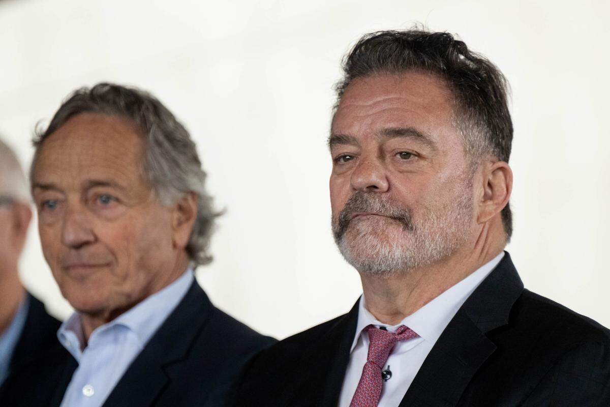 Developer Mark Friedman, left, and Barry Broome, of the Greater Sacramento Economic Council, listen as Sacramento regional leaders announce the region’s bid to secure a Major League Baseball expansion team during a news conference at The Barn in West Sacramento on Thursday.