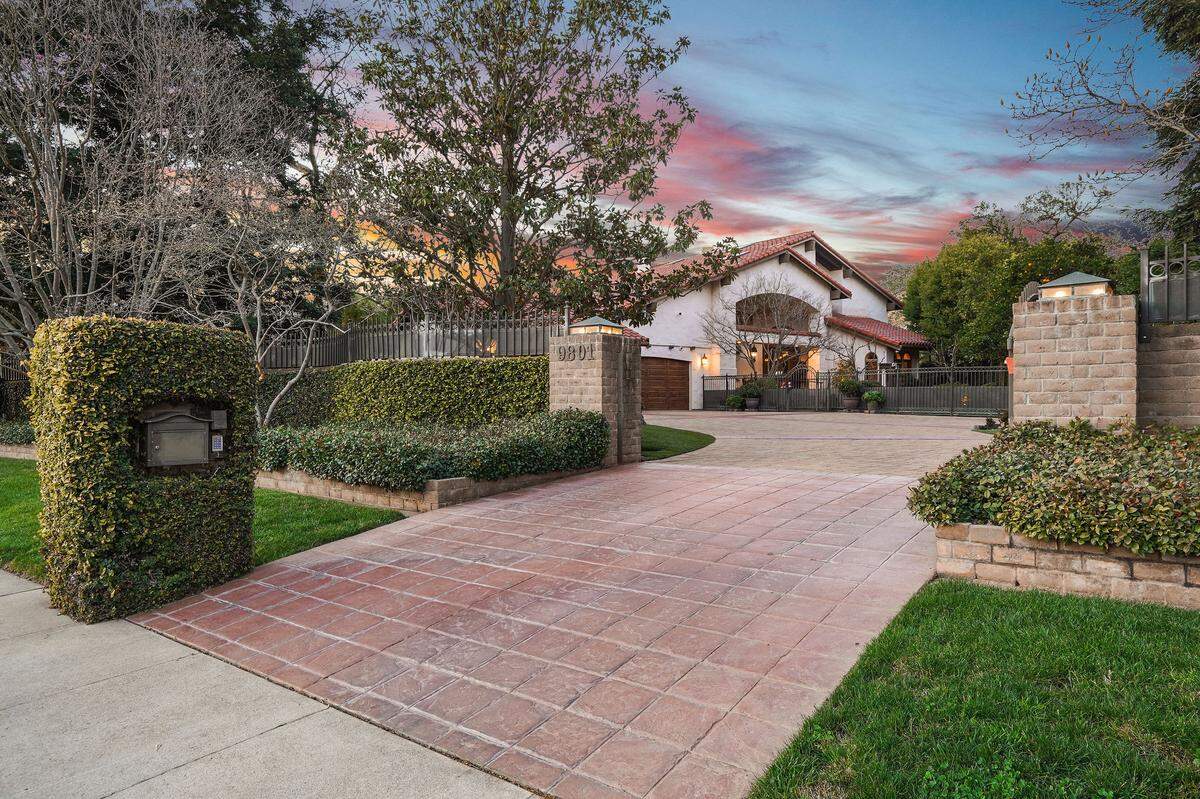 The home lies beyond a private gate in a neighborhood on the south side of American River.