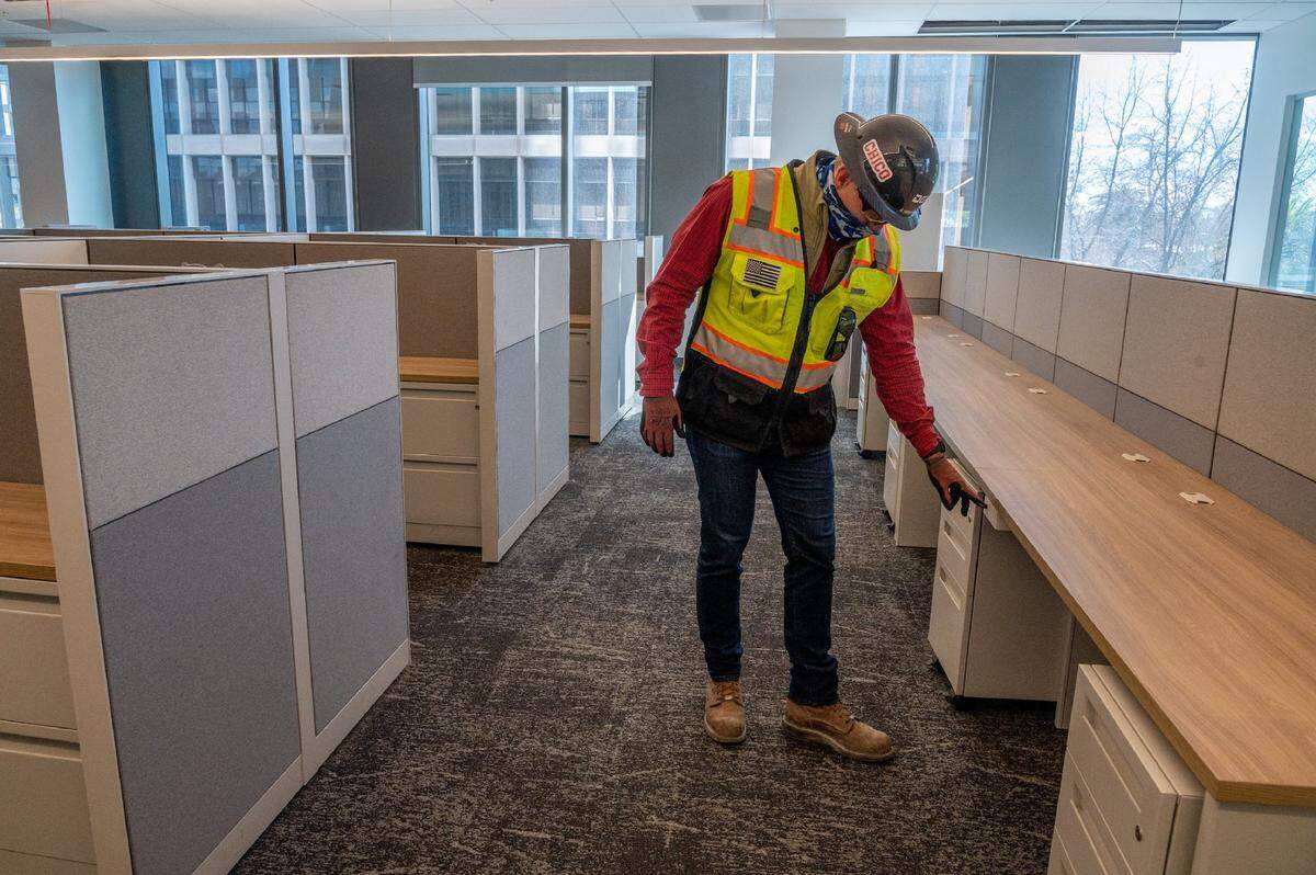 Erik Heerhartz, project director with the state Department of General Services, shows some of the shared work spaces in the new Natural Resources headquarters building in downtown Sacramento on Thursday. “Each floor will have some hoteling space for folks that might not permanently be in the office but temporarily come in from time to time. They will have a place to land a computer and power in,” Heerhartz said.