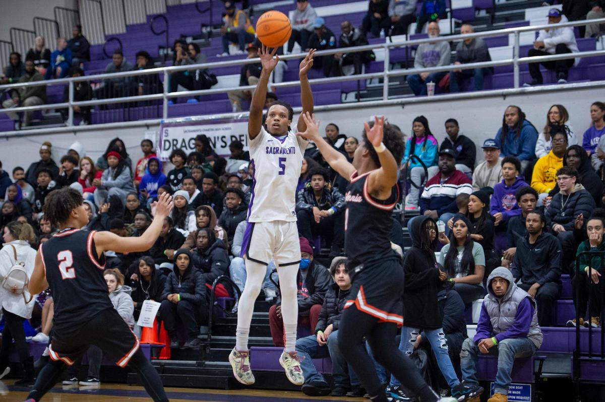 The Sacramento Dragons’ Kendahl Hearne (5) shoots a 3-pointer over the California Grizzlies’ Amari Gray (3) in the first round of the CIF Northern California Division II regional playoffs on Tuesday at Sacramento High School. The Grizzlies won 69-63.