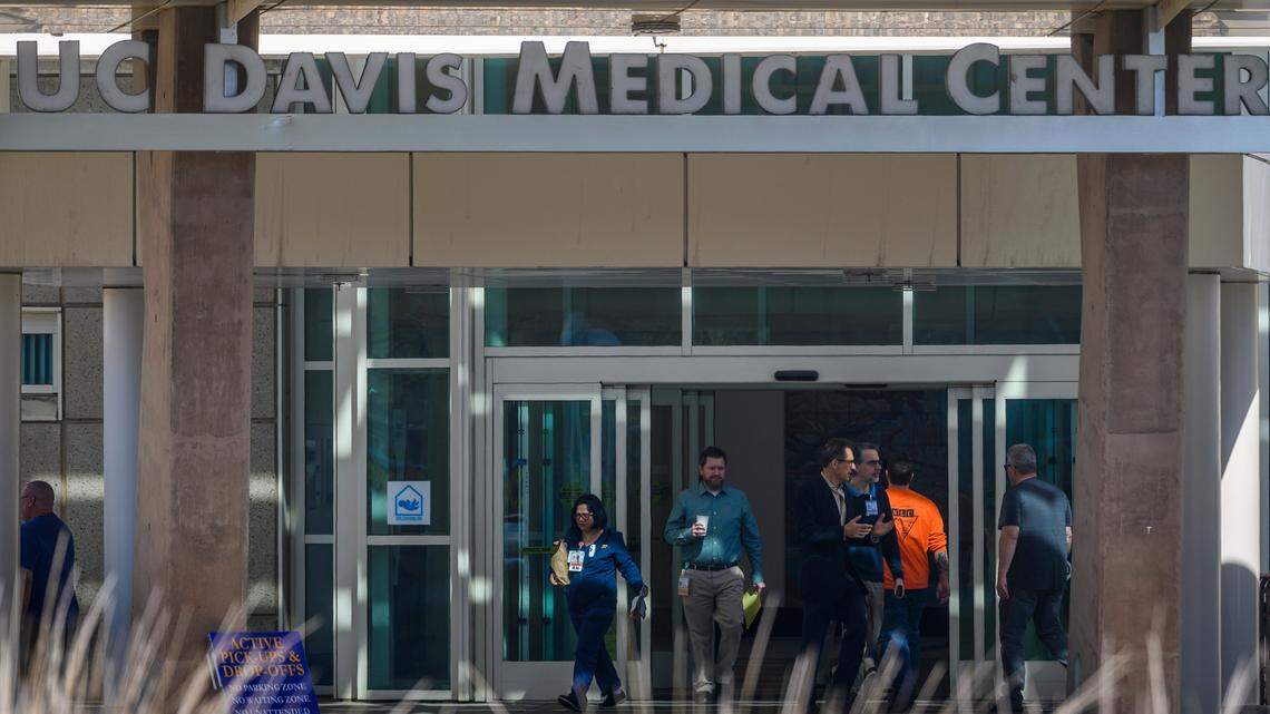 Hospital staff members leave the entrance of UC Davis Medical Center on Tuesday, Feb. 27, 2020, in Sacramento. A patient from Solano County, representing the first confirmed case of the coronavirus in the United States of unknown origin, was treated for novel coronavirus at the hospital.