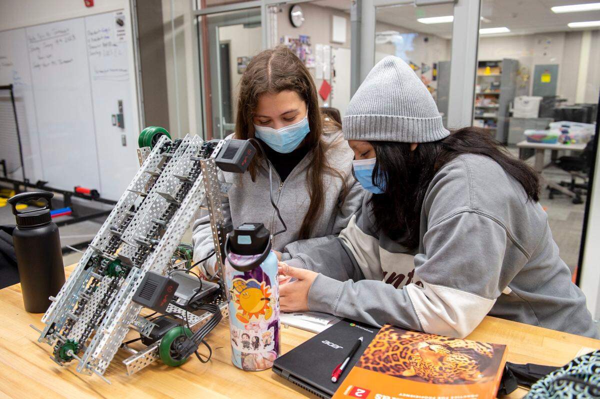 Florin High School juniors Anastasiya Zakharchuk,16, left, and Priyasha Kaur, 16, work on a project in an after school robotics program on Thursday, Dec. 8, 2022.