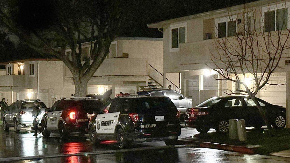 Deputies block the driveway to a townhome on the 5700 block of Shadow Creek Drive in Carmichael after the discovery of three adults found shot and killed in an upstairs unit on Saturday. Coroner’s officials confirmed two of the victims as a husband and wife.