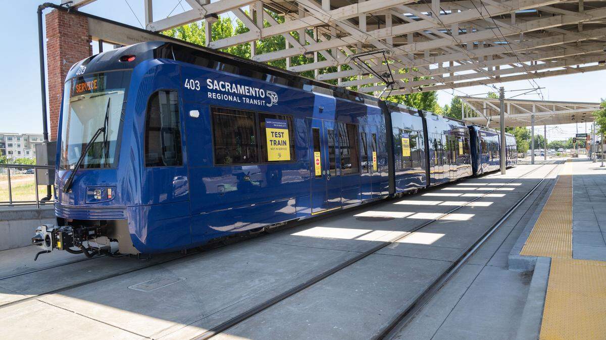 One of Sacramento Regional Transit’s S700 low-floor light rail train awaits riders at the Township 9 station in Sacramento on June 12, 2024.