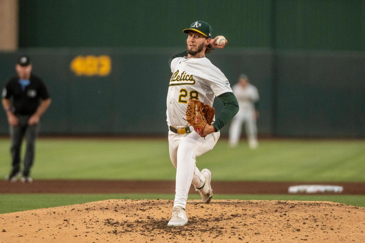 Athletics pitcher Mitch Spence (28) throws a pitch against the Houston Astros during a baseball game at Sutter Health Park on Monday.