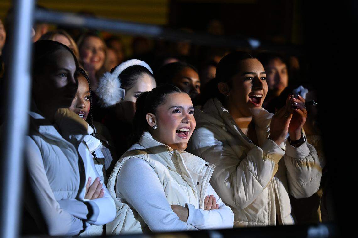 Members of the Sacramento Dance Lab react to a dance performance at the Theatre of Lights Tree lighting ceremony in Old Sacramento on Wednesday.