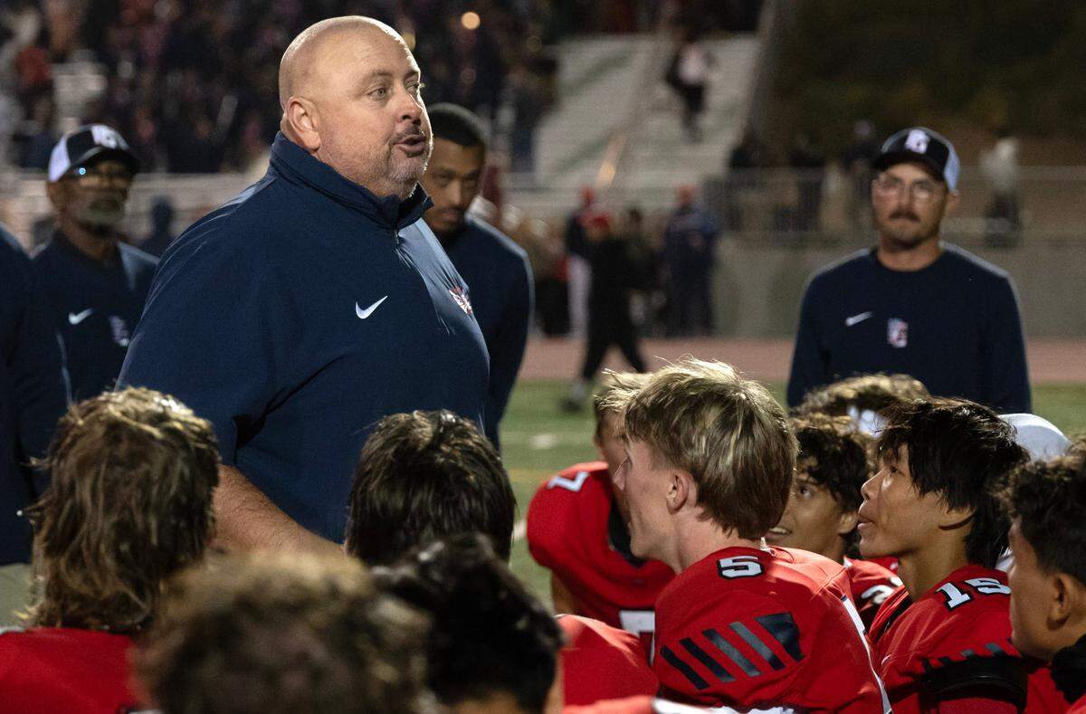 Pleasant Grove head coach Josh Crabtree speaks to his team after a upset victory over the Elk Grove Thundering Herd on Friday.