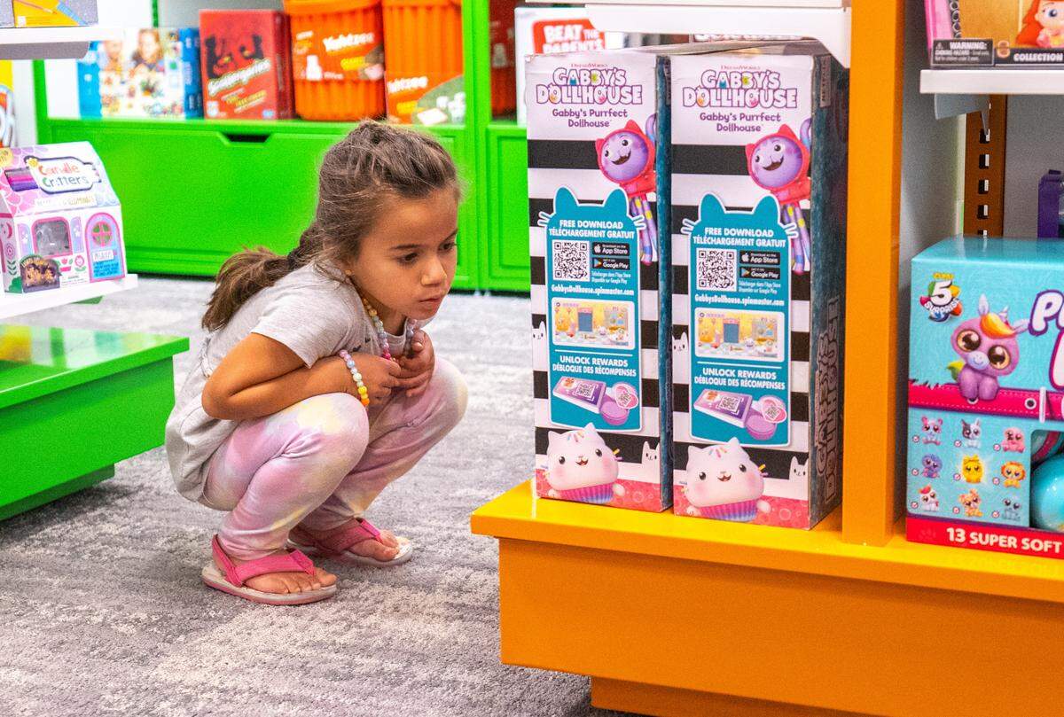 Samira Boyer, 5, picks out her favorite toy in the Toys R Us section in Arden Fair Mall’s Macy’s on Tuesday August 9, 2022.