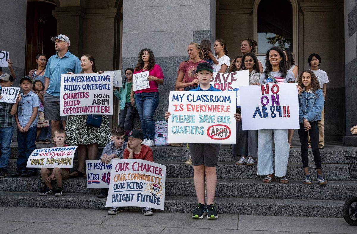 Families rally against Assembly Bill 84, which seeks to place stricter auditing standards on charter schools, at the state Capitol on Wednesday.