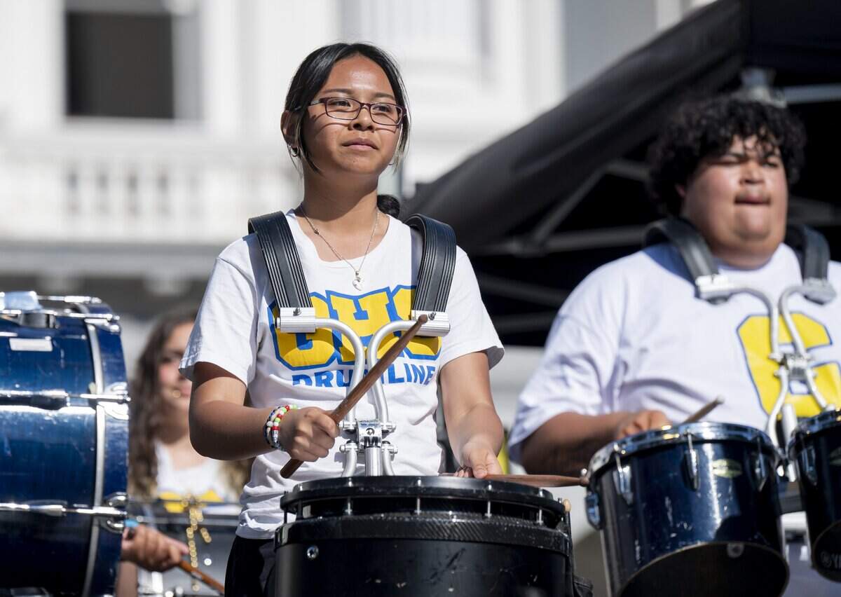The Grant High School Drumline performs in front of the California Capitol during a Juneteenth celebration Wednesday.