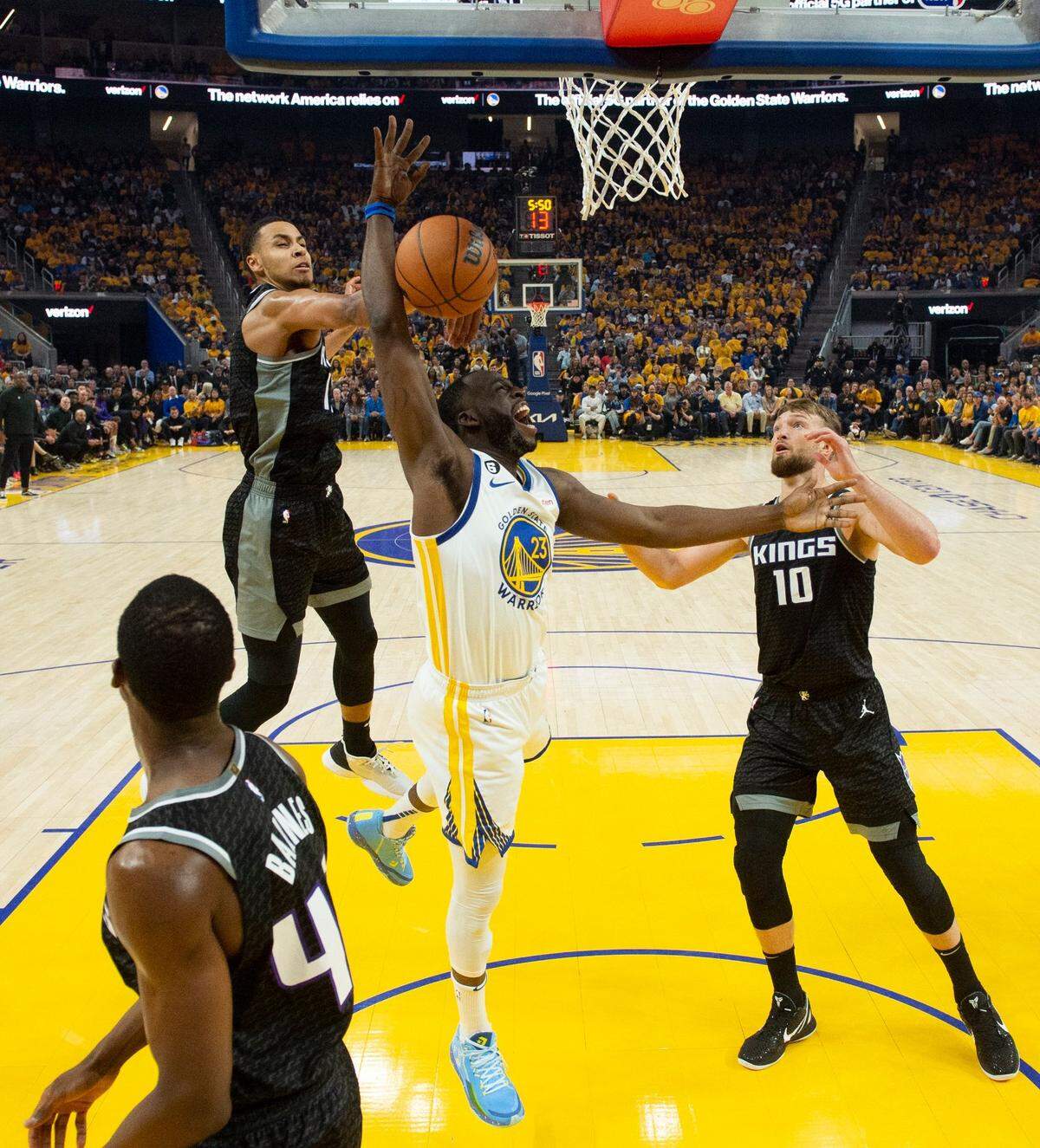 Sacramento Kings forward Keegan Murray (13) blocks shot by Golden State Warriors forward Draymond Green (23) during Game 4 of the first-round NBA playoff series at Chase Center in San Francisco on Sunday, April 23, 2023.