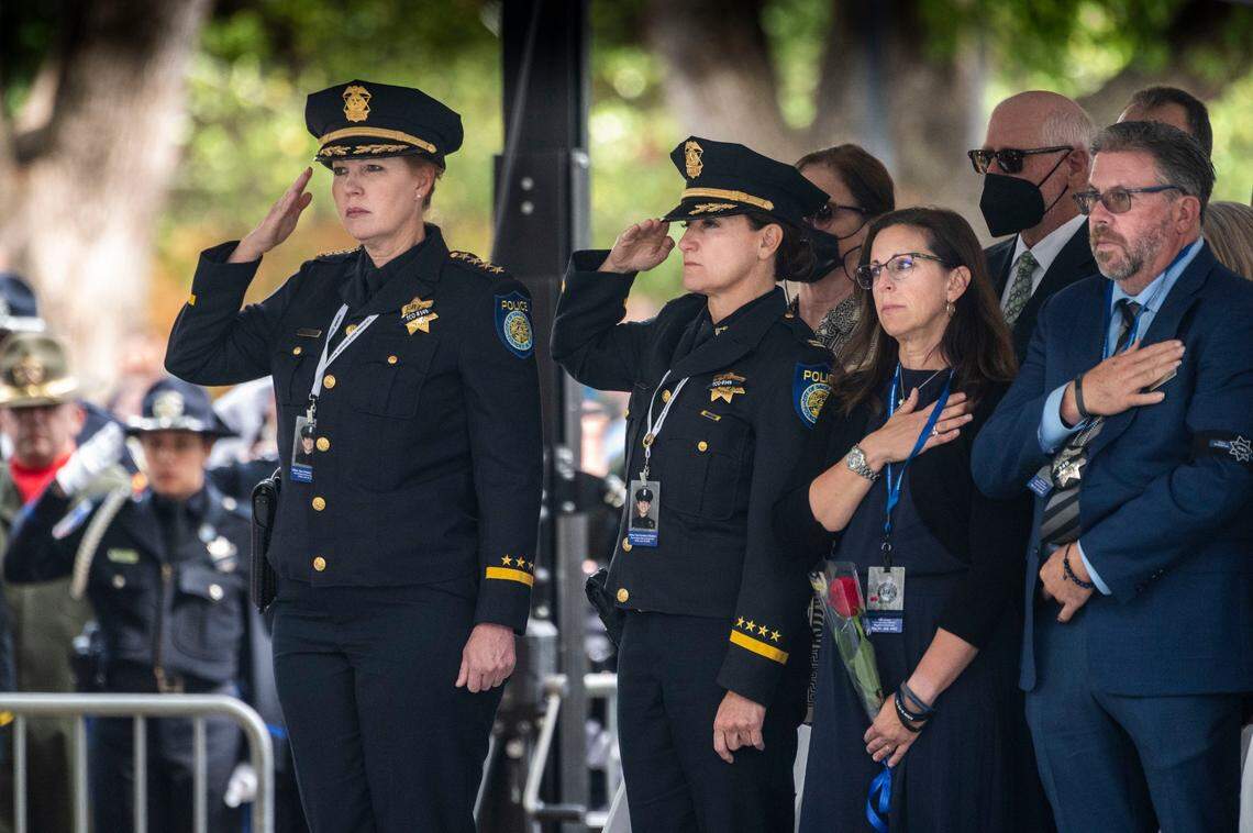 Sacramento Police Chief Kathy Lester joins Kelly and Denis O’Sullivan, the parents of fallen Sacramento Police officer Tara O’Sullivan, on Monday, May 2, 2022, during the annual ceremony to add the names of fallen officers to the California Peace Officers Memorial at the state Capitol in Sacramento. O’Sullivan was fatally shot in 2019 while responding to a domestic disturbance call.