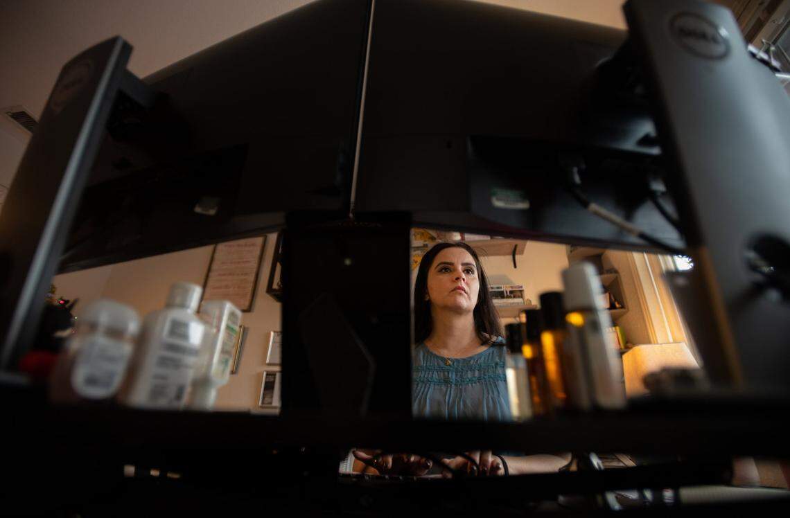 Department of General Services employee Monica Hassan telecommutes from her Sacramento-area home office in November.