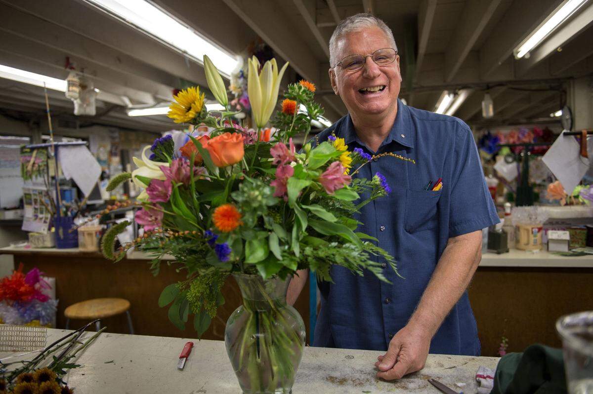 Jim Relles prepares a flower arrangement to bring home to his wife on Tuesday, Sept. 27, 2016 in Sacramento. Relles Florist, a longtime Sacramento institution, celebrated its 70th birthday that year.