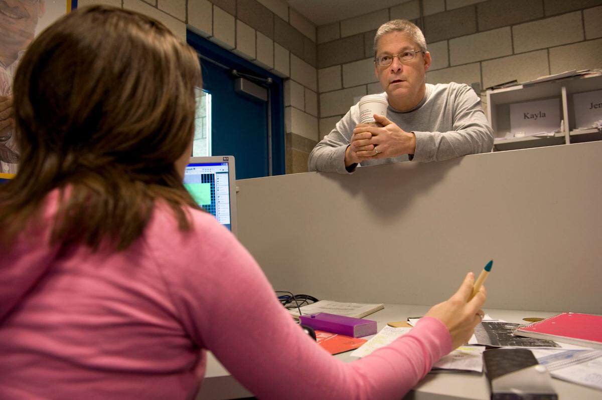 Teacher Casey Nichols, who won the 2004 National Yearbook Advisor of the Year, talks to student Brenna O’Neil during yearbook class at Rocklin High School in 2010.