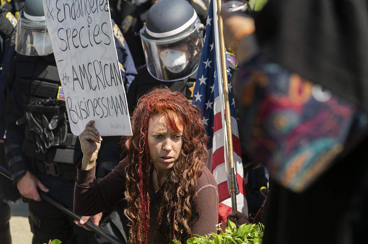 A protestor demonstrates at the Capitol in Sacramento on Friday, May 1, 2020, against Gov. Gavin Newsom’s stay-at-home order to slow the spread of the coronavirus.