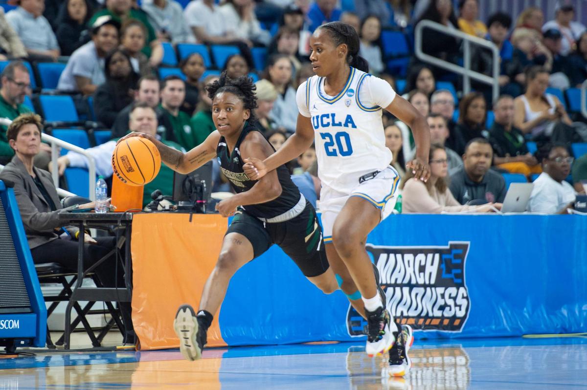 Sacramento State Hornets guard Kahlaijah Dean (0) dribbles downcourt with UCLA Bruins guard Charisma Osborne (20) defending in a first-round 2023 NCAA women’s basketball tournament game at Pauley Pavilion in Los Angeles.