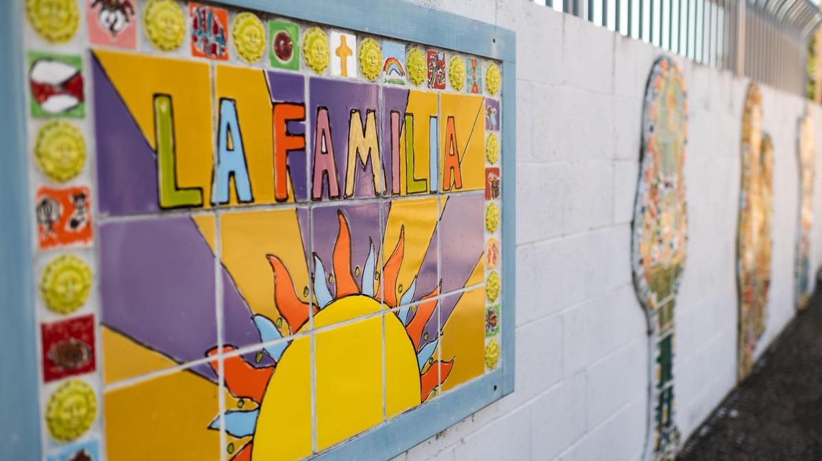 Tile artwork is seen outside of La Familia Counseling Center in Sacramento on Tuesday, June 23, 2020, near a mostly empty parking lot due to coronavirus restrictions. Executive Director Rachel Rios said her staff is busier than ever with assisting people with a variety of needs either on the phone, video chat or by appointment while maintaining social distancing and mask requirements.