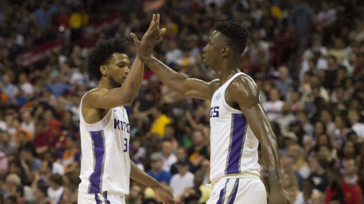 Sacramento Kings forward Marvin Bagley III, (35) celebrates a basket with teammate Harry Giles during their game against the Phoenix Suns in the Summer League game in Las Vegas, Nev. on Saturday, July 7, 2018.