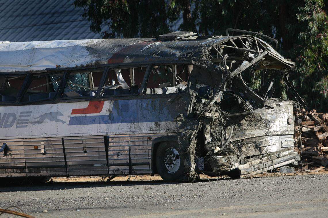 The charter bus driven by Quinton Watts – its front end crushed by its collision with a ditch – rests inside a wrecking yard in Williams in 2008, the day after the fatal crash.
