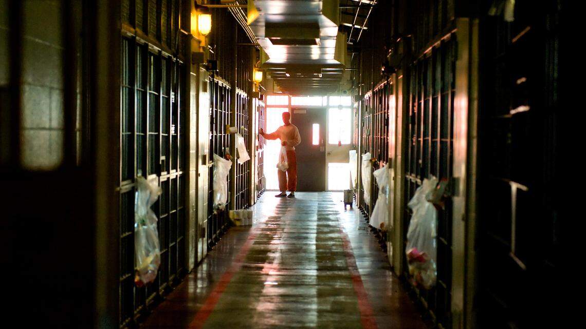 An inmate hands out supplies inside a dorm at the Rio Cosumnes Correctional Center in Sacramento County on March 23, 2009.