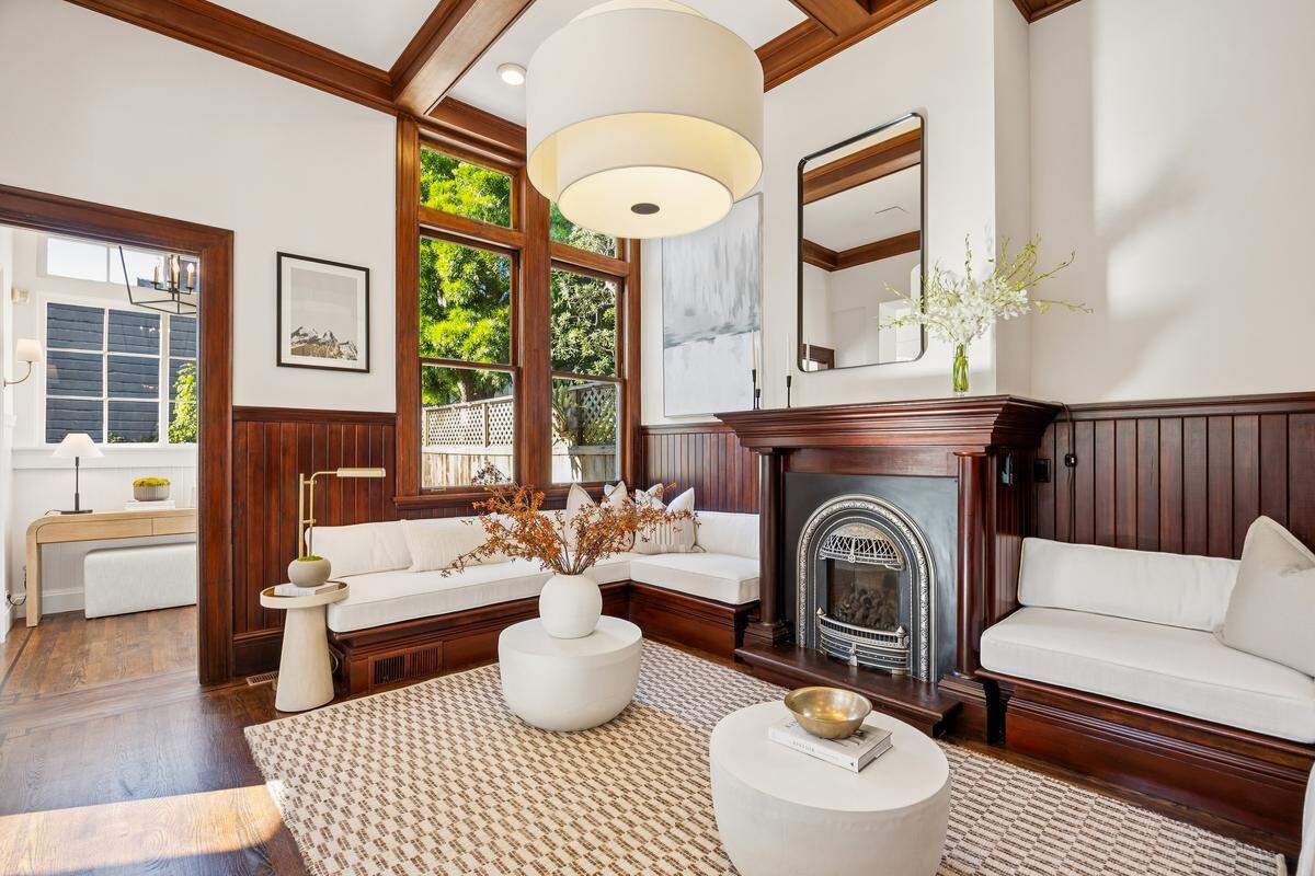 The mansion’s main floor, filled with natural south-facing light, features soaring ceilings, original woodwork and a grand dining room overlooking a magnolia-lined street,