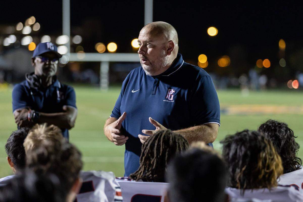 Pleasant Grove coach Josh Crabtree talks with his team after a game against the Laguna Creek Cardinals in 2022.