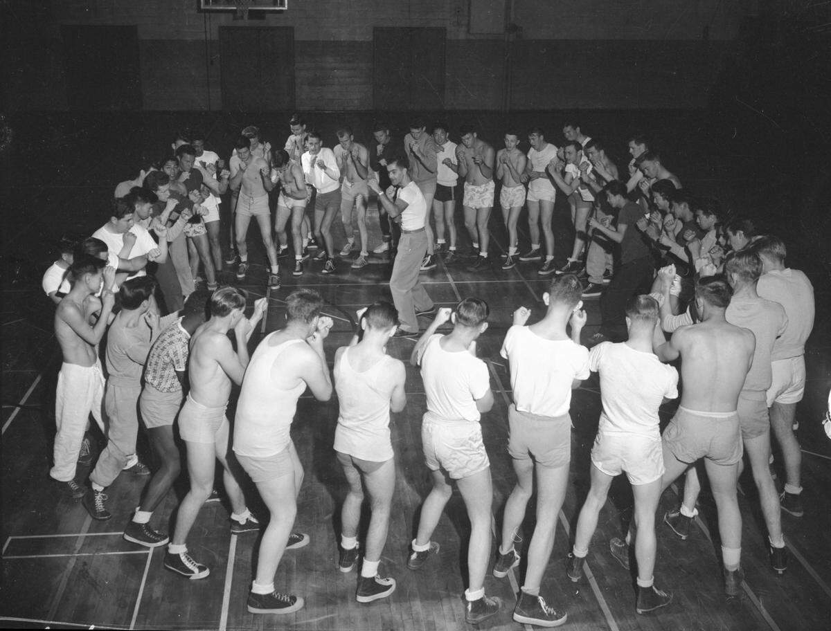 Student assistant coach Pete Franusich demonstrates the proper stance to a boxing class at Sacramento Junior College in April 1950.