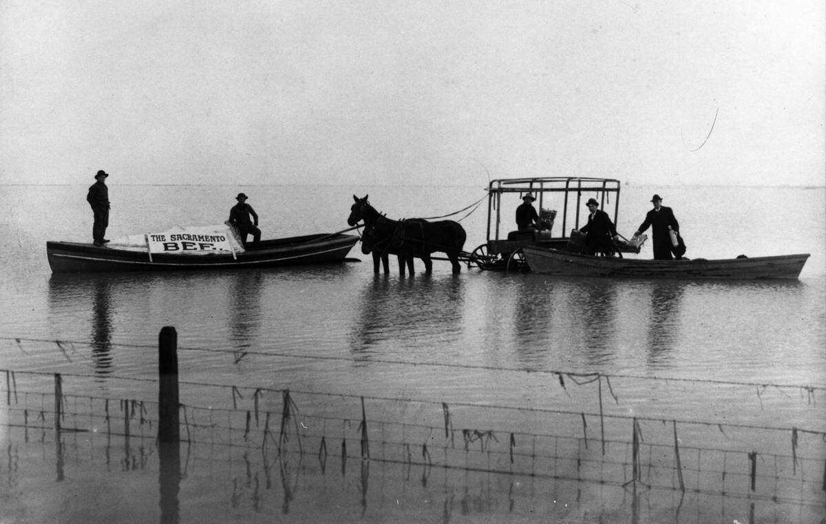 Sacramento Bee newspapers are delivered during the flood of 1862 using boats and mules. 