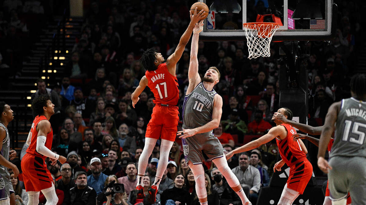 Portland Trail Blazers guard Shaedon Sharpe (17) grabs a rebound during the first half against Sacramento Kings forward Domantas Sabonis (10) on Wednesday, March 29, 2023, at Moda Center in Portland, Oregon.