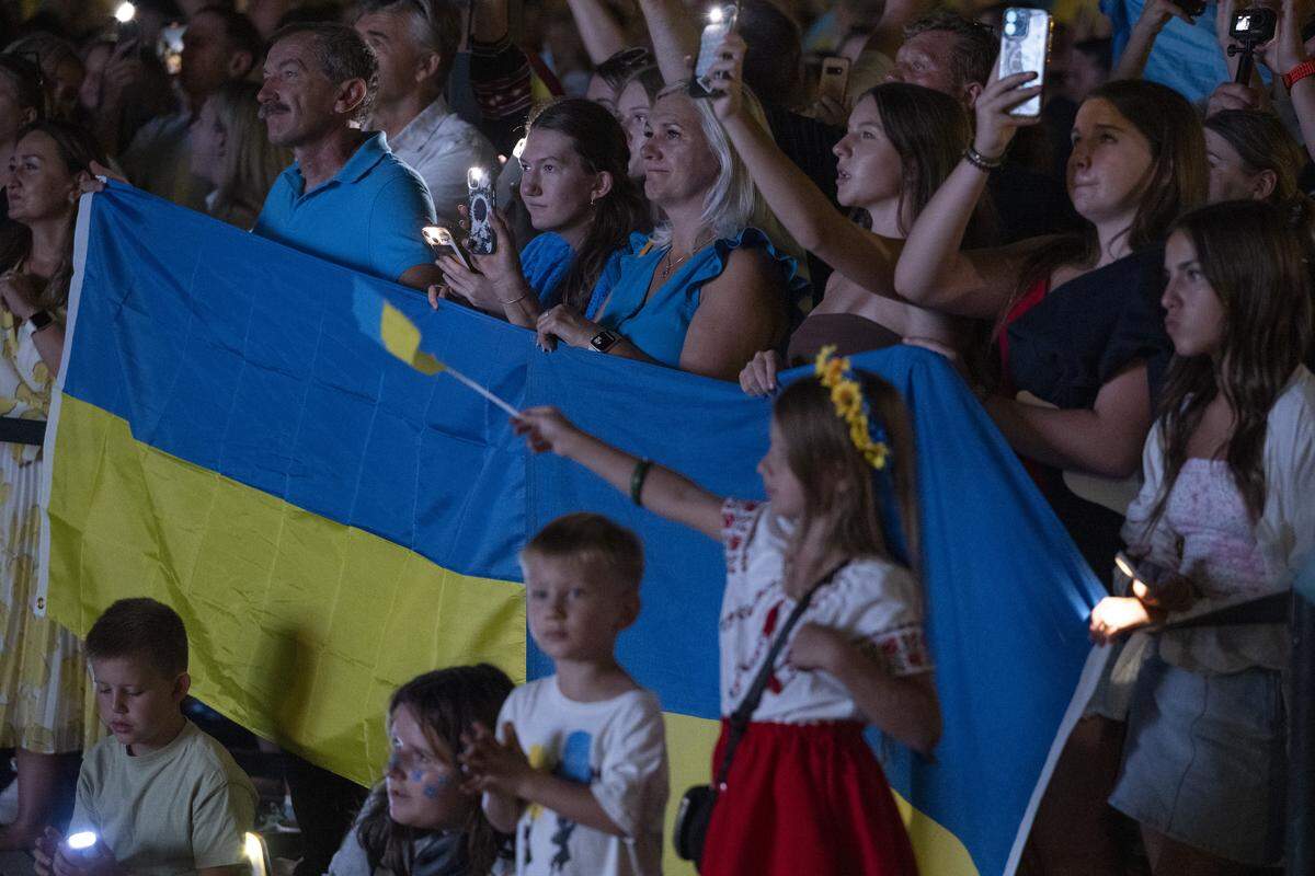 Ukrainian Americans listen to musical performances during a Ukrainian Independence Day celebration at the California Capitol in Sacramento on Sunday.