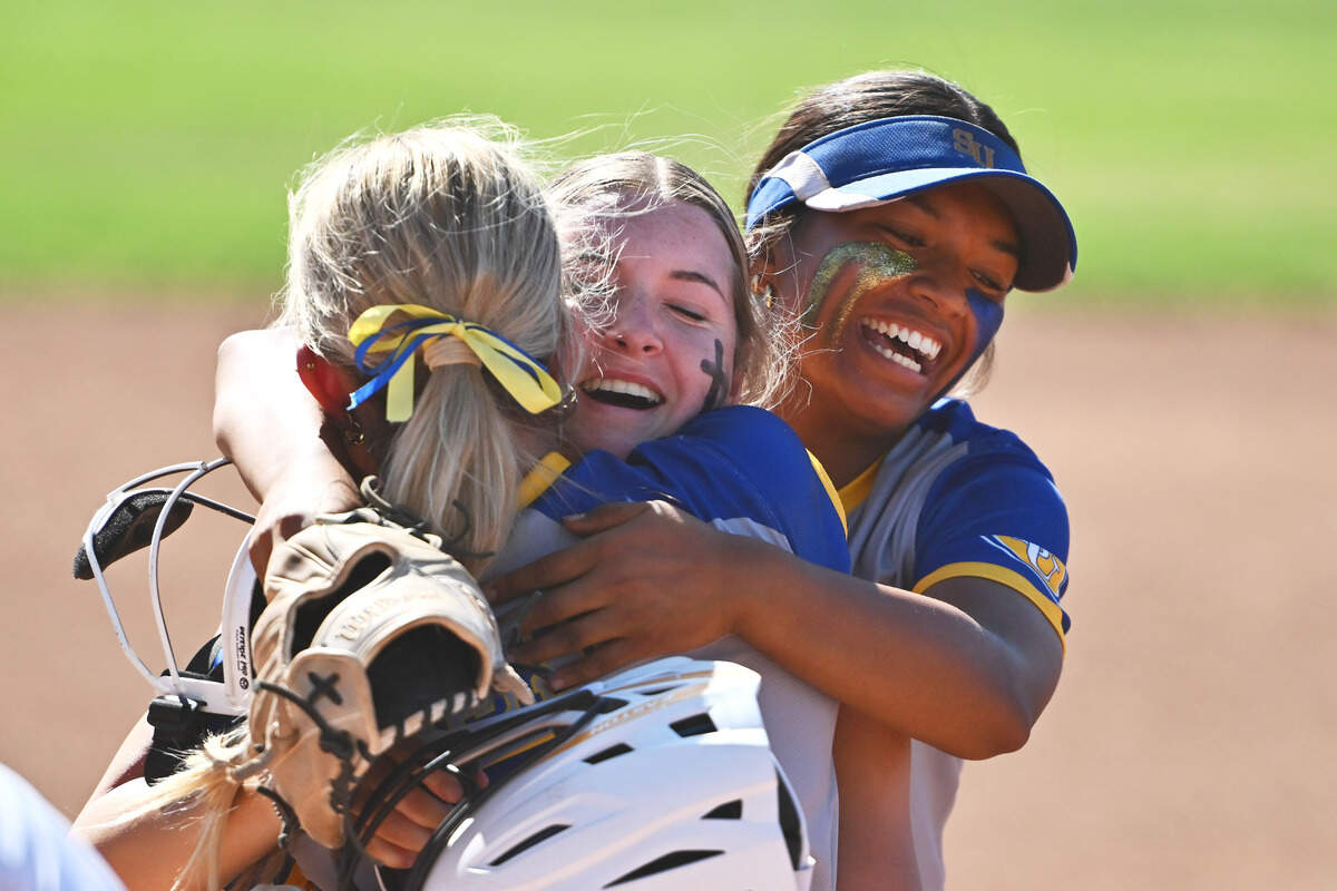 Sutter pitcher Olivia Bauer, left, celebrates with her teammate Morgan Heggstrom, center, and Grace Diaz after defeating College Park during their Northern California Division III softball semifinal game at College Park High School in Pleasant Hill on Thursday. Sutter defeated College Park 3-2.