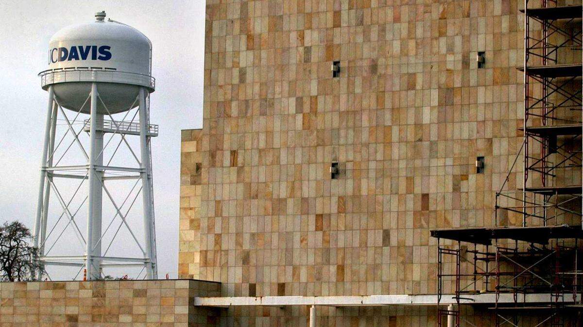 The landmark UC Davis water tower looms over the UC Davis Arts Center. Undergraduate studies in the fall will be conducted through a combination of in-person and remote teaching.