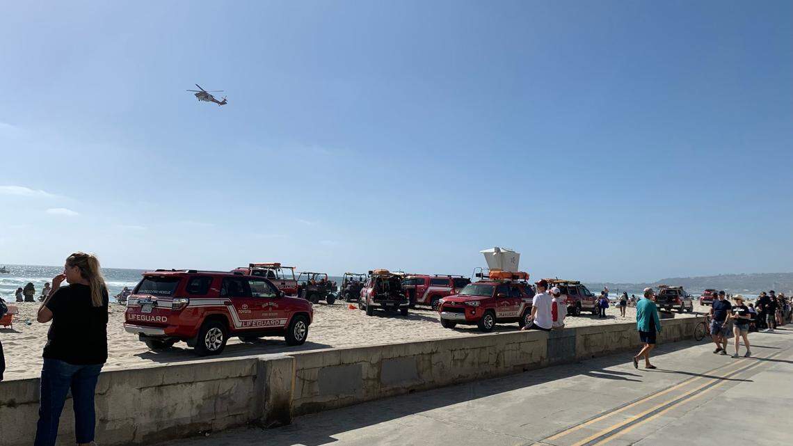 An 18-year-old is missing after getting caught in a current at Mission Beach, officials say.