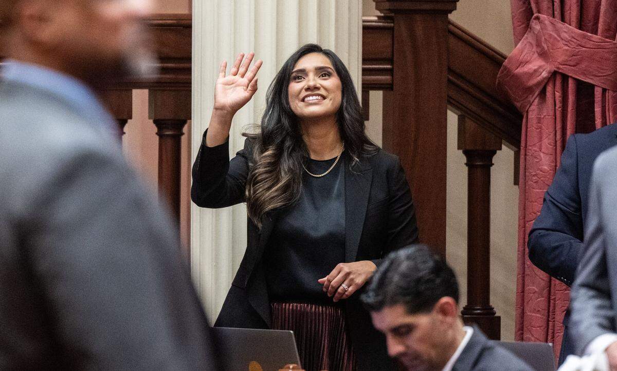 New state Sen. Sabrina Cervantes, D-Riverside, waves to guests before members of the California Senate are sworn in during the first meeting of the legislative session on Monday at the state Capitol.