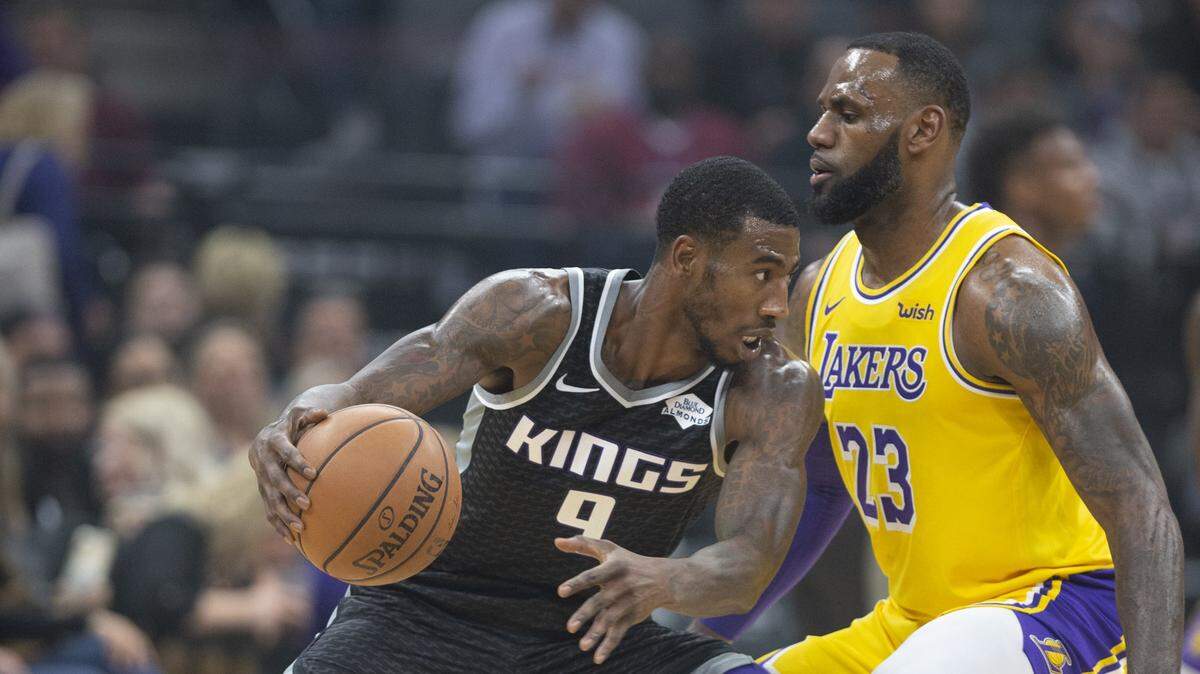 Kings swingman Iman Shumpert, left, dribbles against Los Angeles Lakers forward LeBron James on Saturday at Golden 1 Center. The two were teammates in Cleveland and helped the Cavaliers win the NBA title in 2015-16.