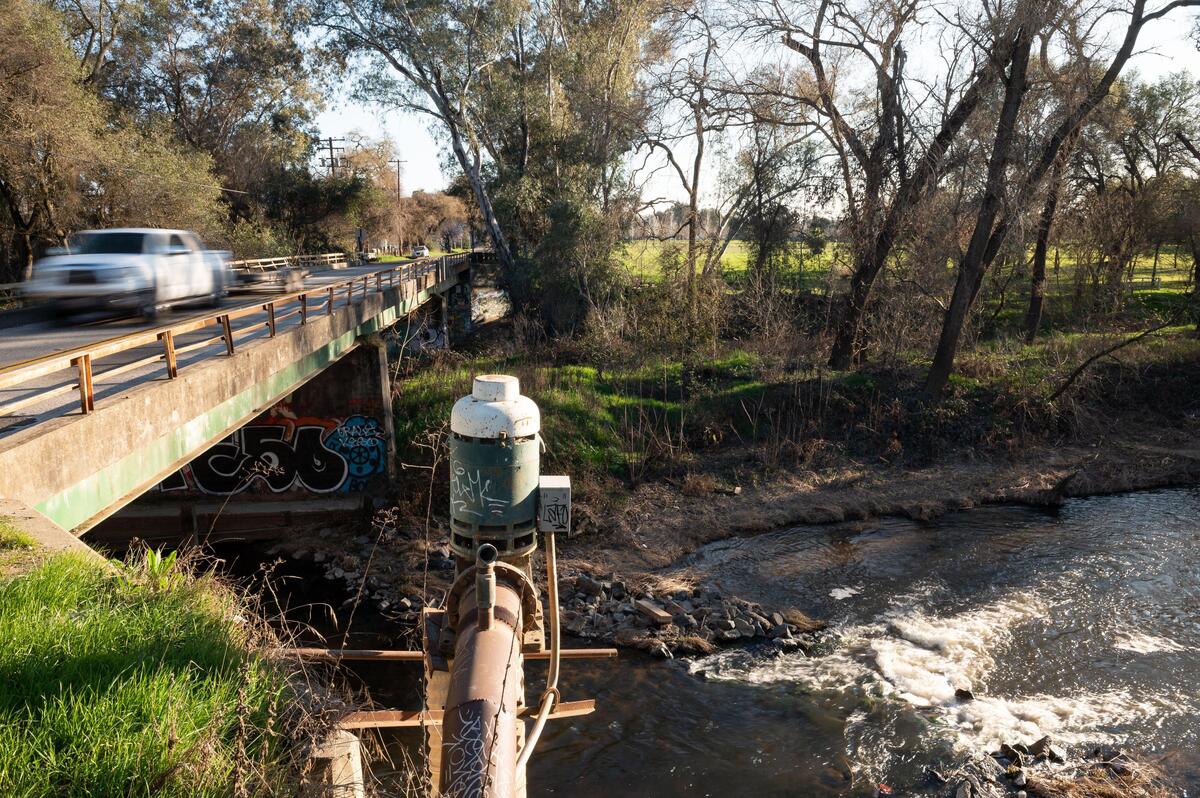 Traffic moves across the narrow bridge on Watt Avenue over Dry Creek on Wednesday, Feb. 26, 2020, at the border of Sacramento and Placer counties. Illegal dumping in the vicinity — including nearby Dyer Lane, Tan Woods Road and Kasser Road — has been a longtime problem.