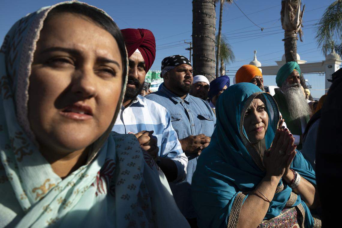 Members of the Sikh community pray before the start of the Nagar Kirtan, also known as the Sikh Parade, in Sutter County on Sunday, Nov. 2, 2025.