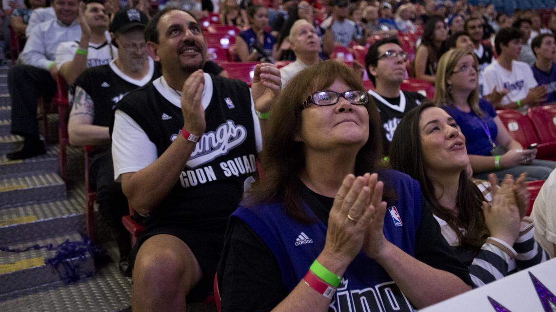 Niko, left, and Barbara Rust, center, applaud after the Kings chose Ben McLemore with the seventh pick in the NBA draft  at Sleep Train Arena on June 27, 2013.