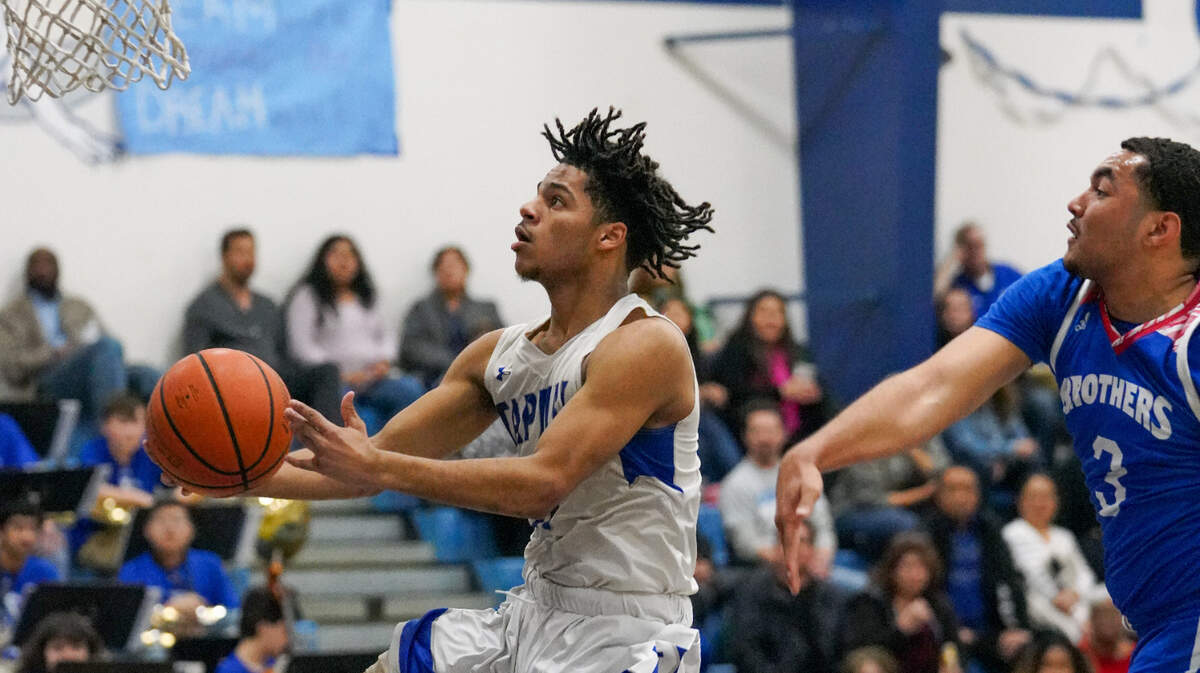 Capital Christian’s Caden Flowers (11) is one of the top basketball players in the Sacramento area.