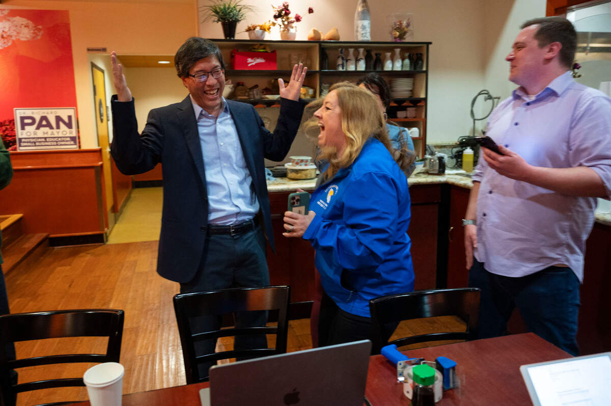 Mayoral candidate Richard Pan, left, celebrates with state Sen. Angelique Ashby and campaign manager Brandon Black after seeing initial results in the primary election March 5, 2024, at his election night party at Sushi Elite in North Natomas.